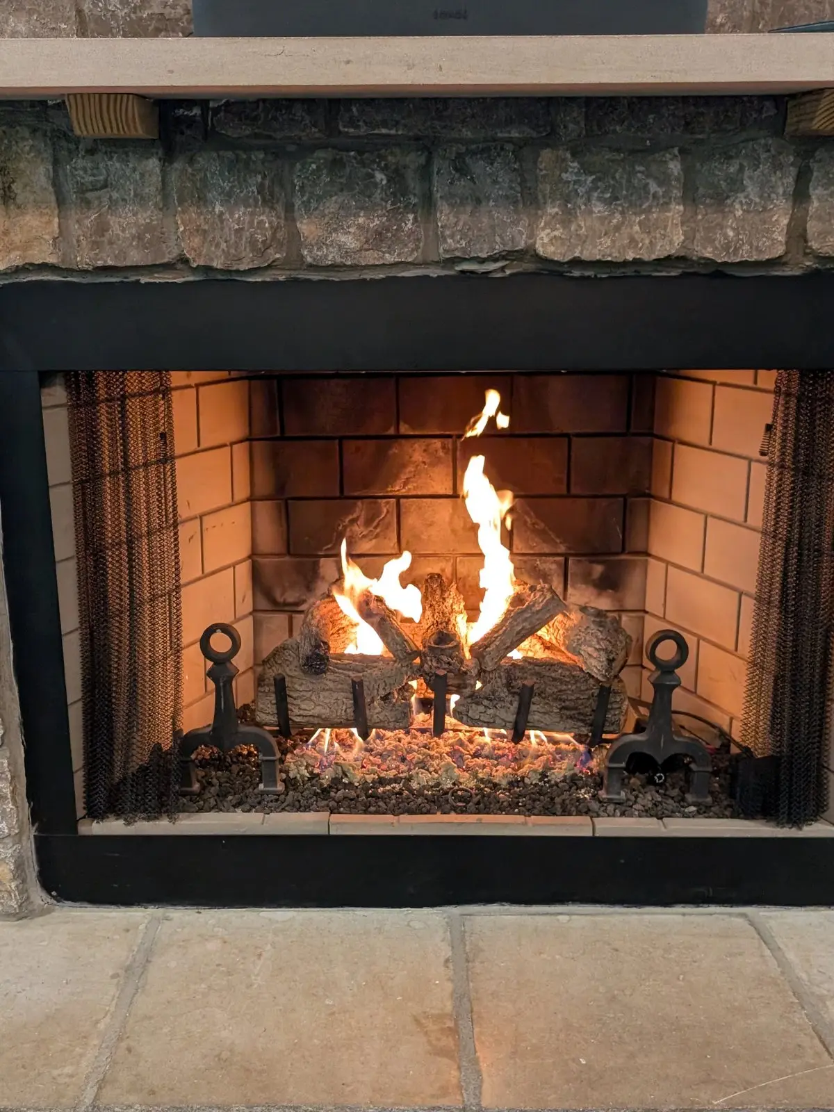 Gas fireplace in a stone surround